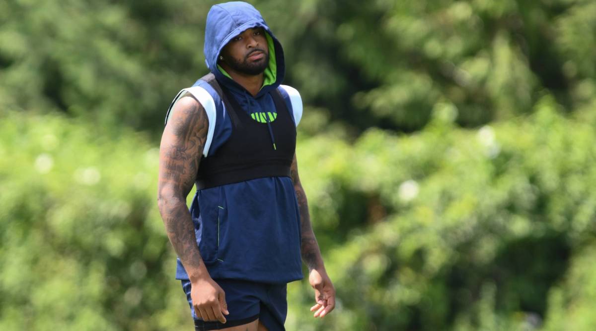 Seahawks safety Jamal Adams stands on the sidelines while rehabbing an injury during practice.